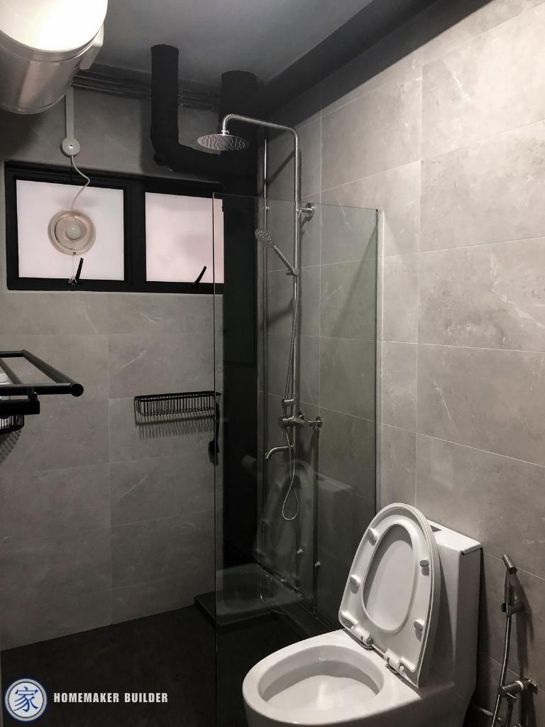 Industrial Bathroom with Homogeneous Tiles and Mirror