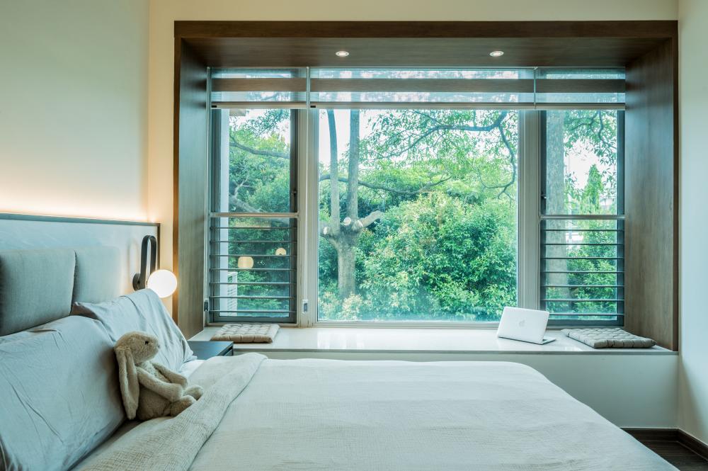 Transitional Bedroom with Bay Window and Downlights