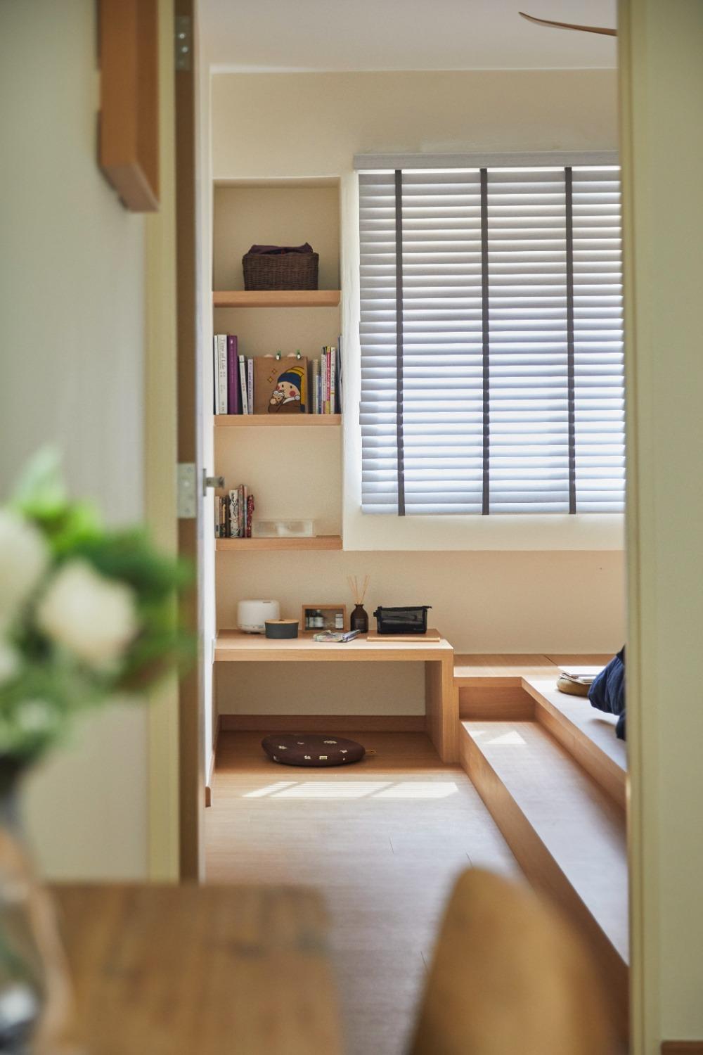 Asian Bedroom with Bookshelf and Platform Bed