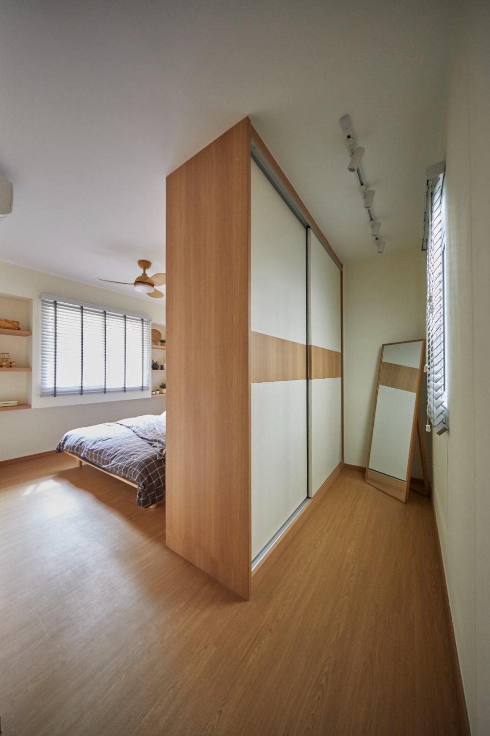 Asian Bedroom with Bookshelf and Wood Flooring