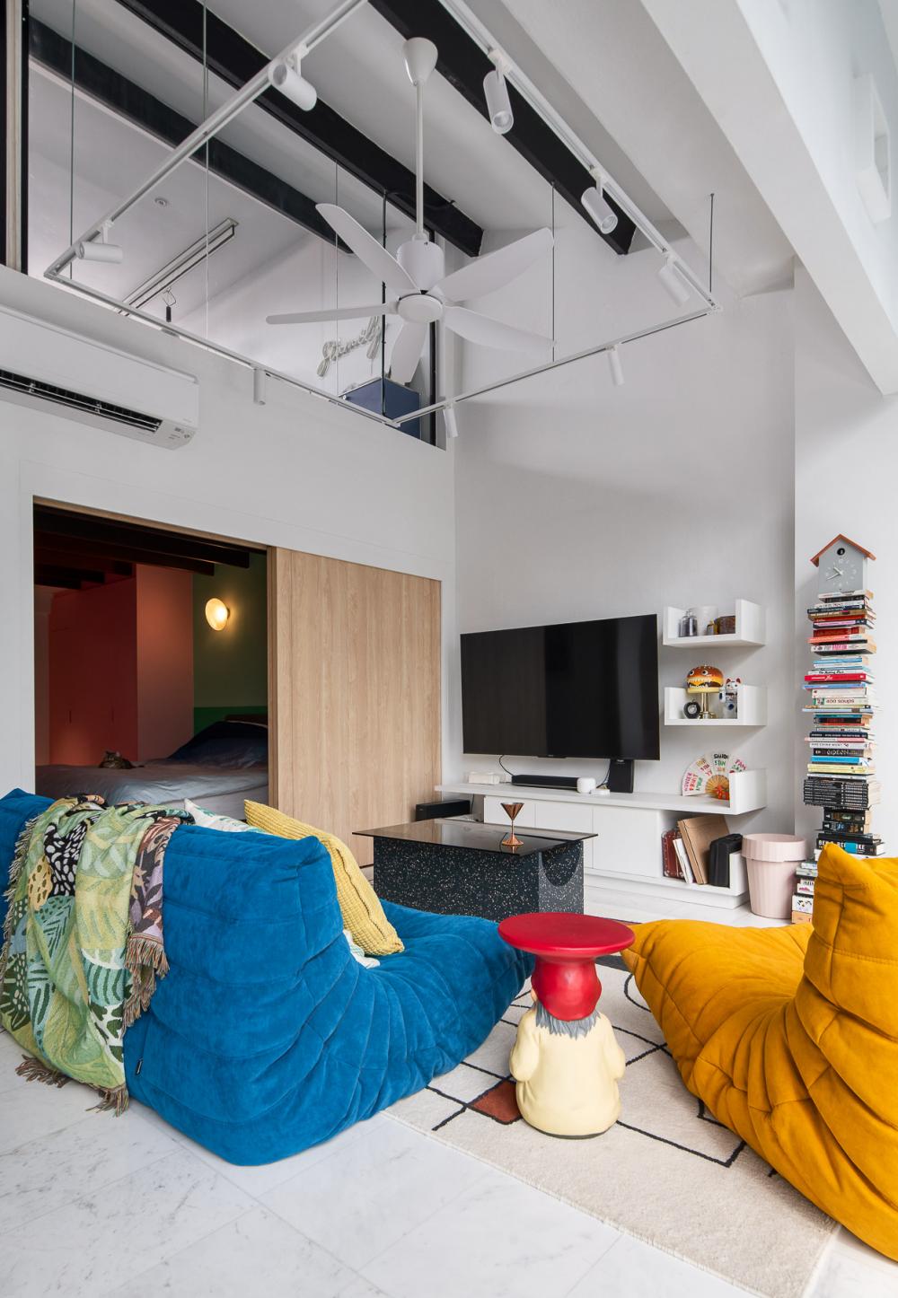 Eclectic Living Room with Bookshelf and Sofa