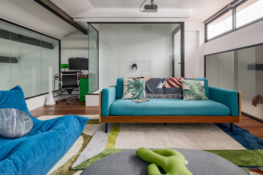 Eclectic Home Theatre with TV Console and Sofa