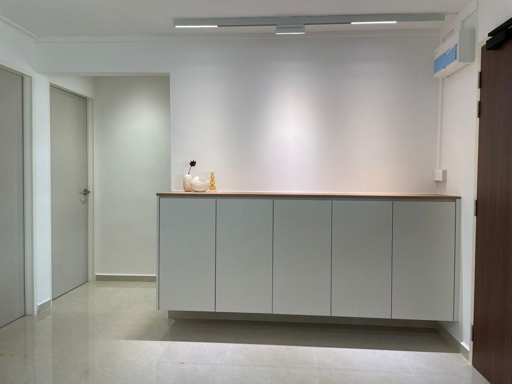 Scandinavian Entryway with Shoe Rack and Storage Cabinets