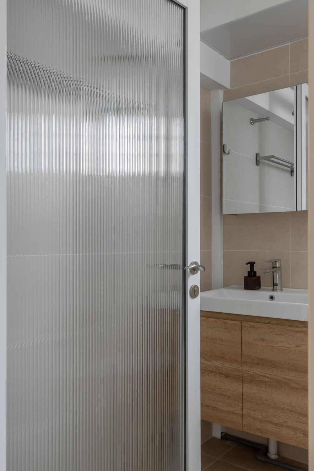 Scandinavian Bathroom with Homogeneous Tiles and Mirror