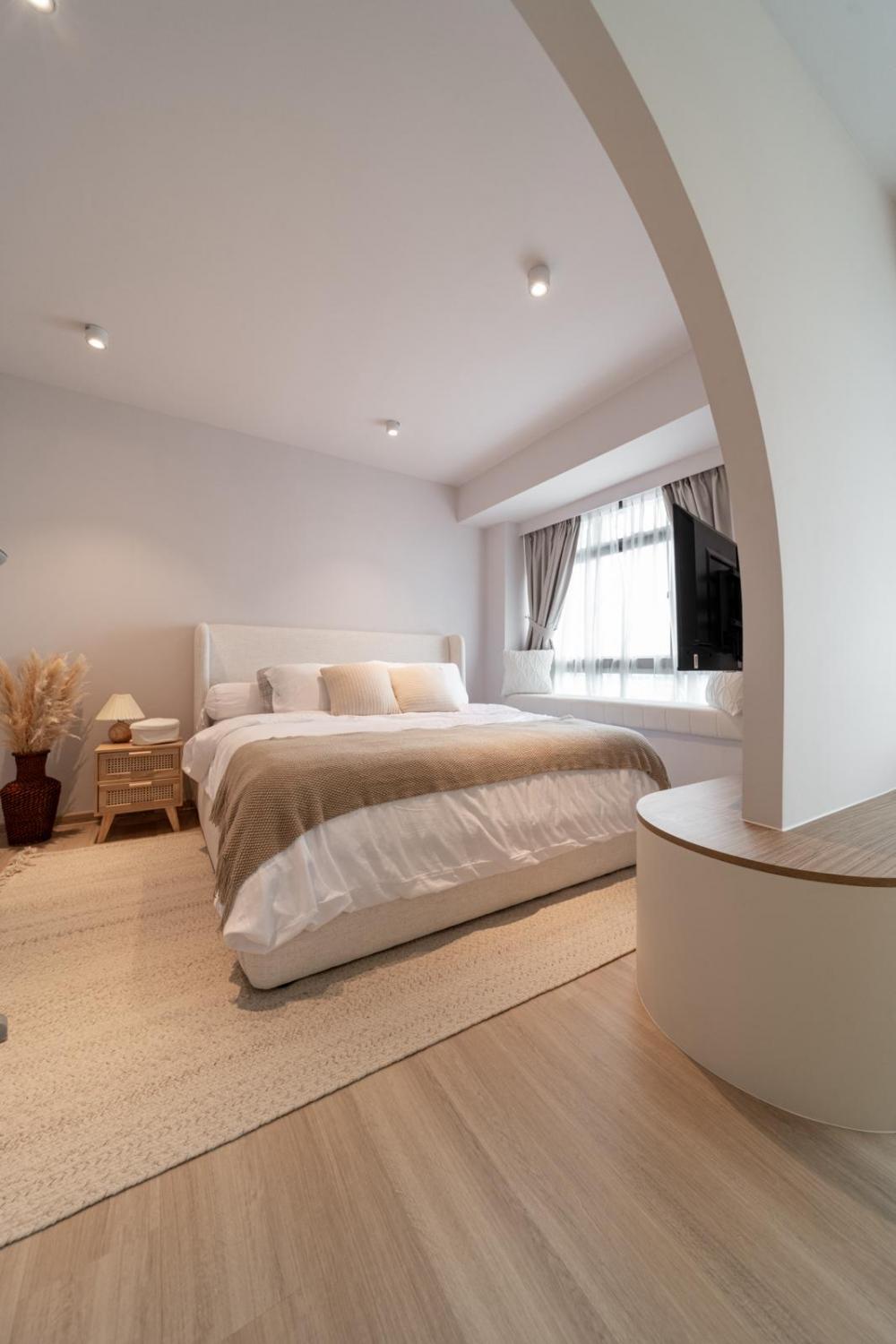 Scandinavian Bedroom with Wood Flooring and Bay Window