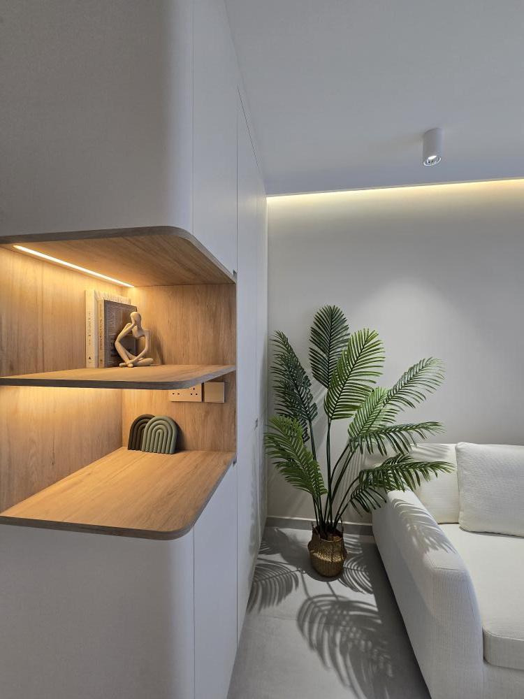 Scandinavian Living Room with Bookshelf and Homogeneous Tiles