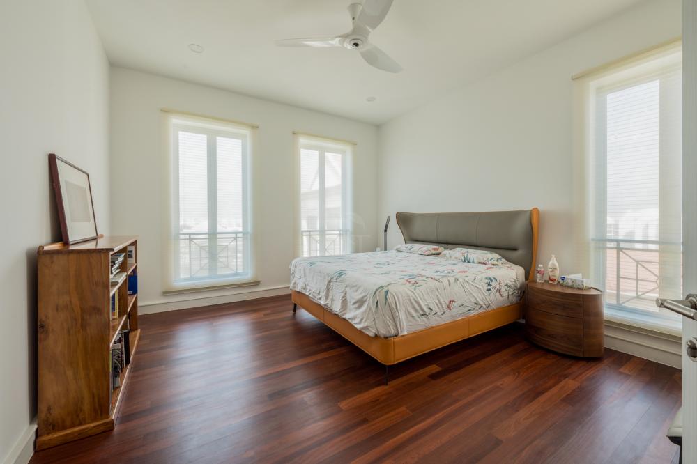 Modern Bedroom with Parquet Floor and Drop Light