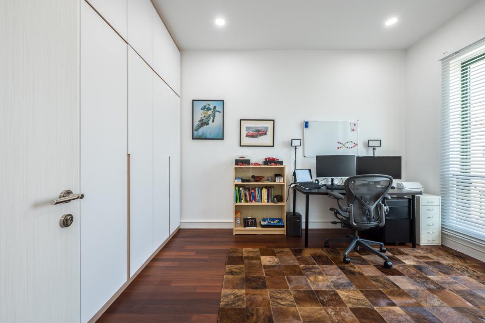 Modern Home Office with Bookshelf and Desk