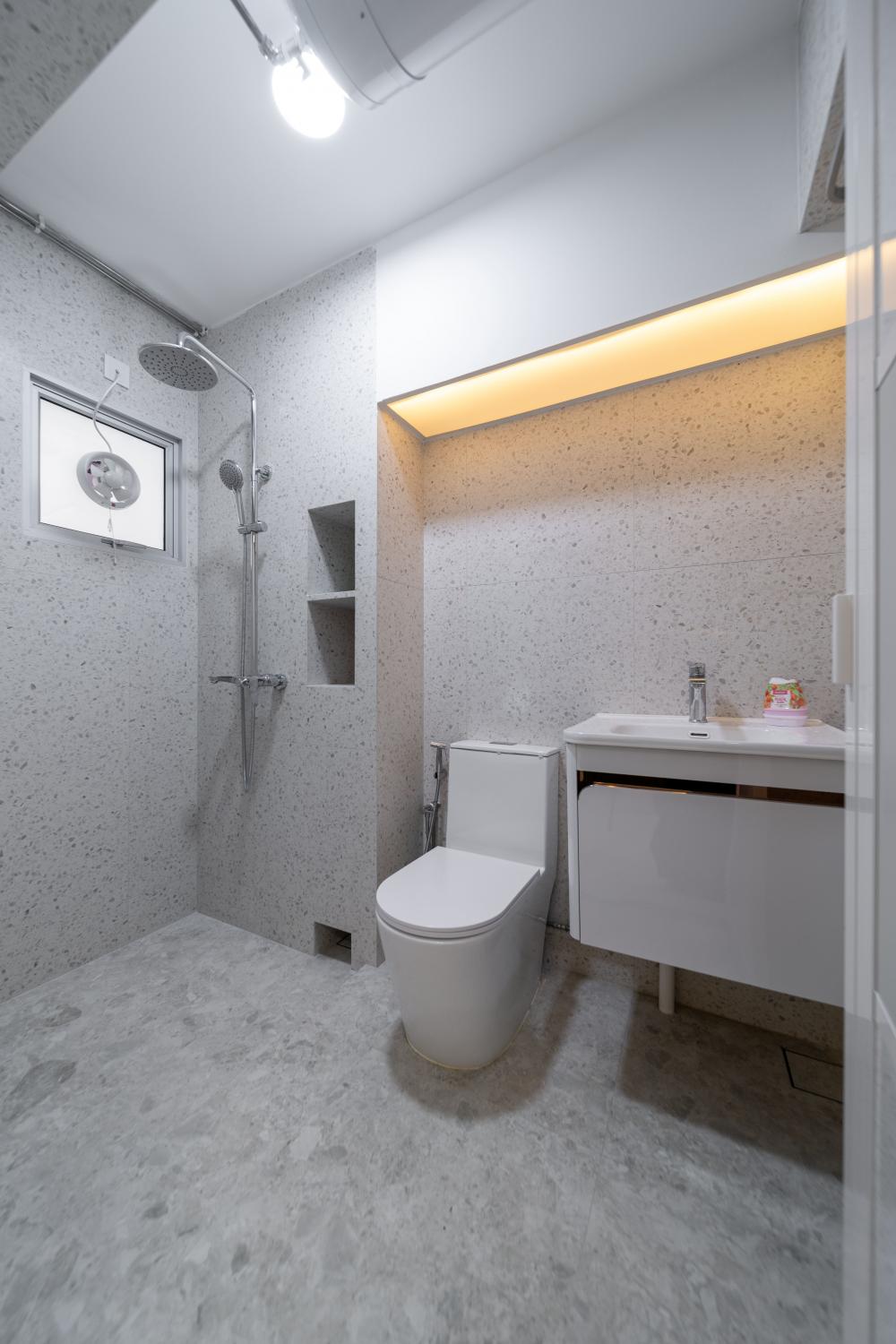 Modern Bathroom with Homogeneous Tiles and Showers