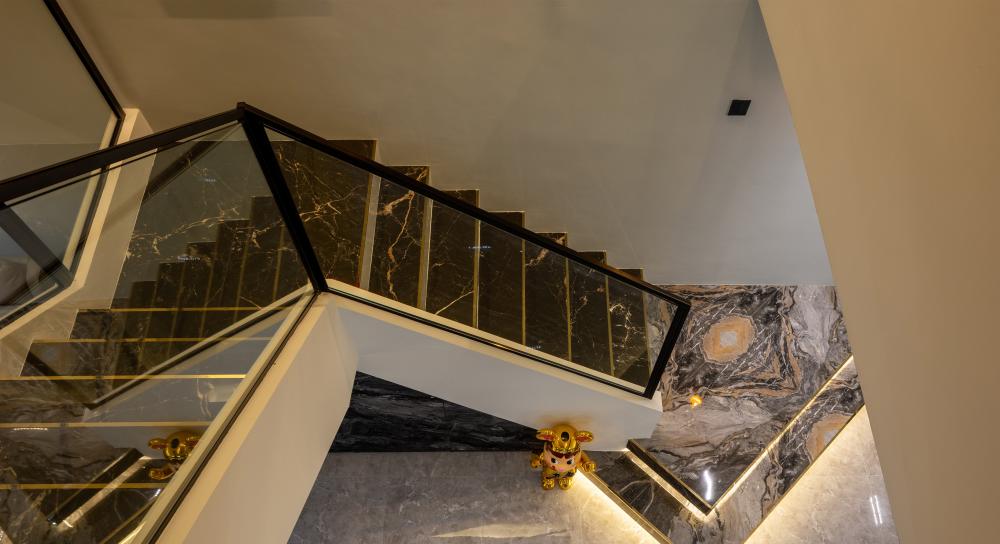 Modern Entryway with Marble Floor and Staircase