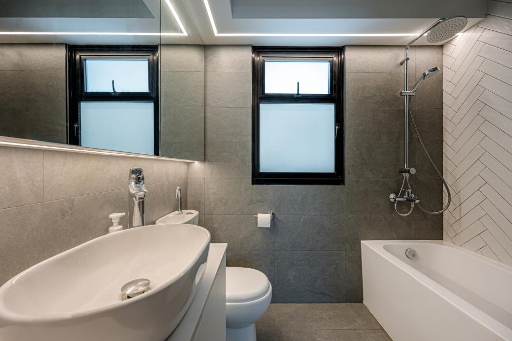 Asian Bathroom with Herringbone Tiling and Mirror