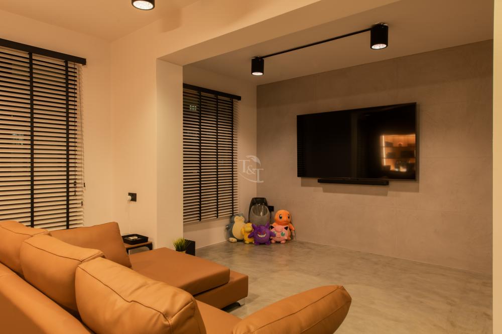 Contemporary Living Room with Cement Floor and Feature Wall