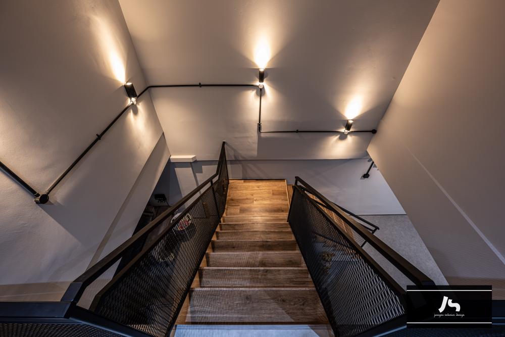 Modern Hallway with Drop Light and Staircase