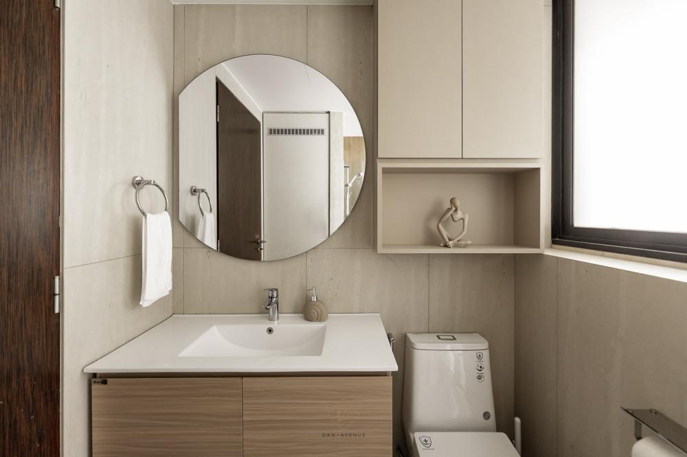 Scandinavian Bathroom with Homogeneous Tiles and Mirror