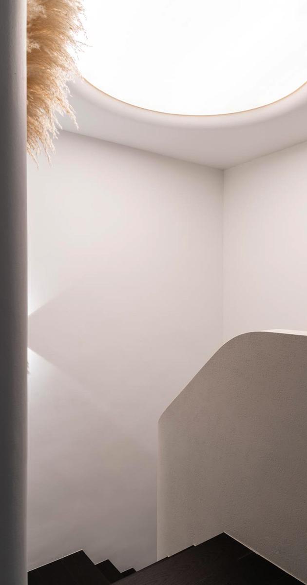 Modern Hallway with Bookshelf and Artwork