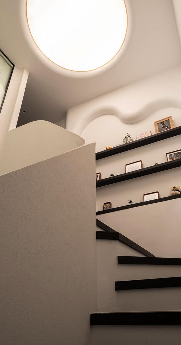 Modern Hallway with Bookshelf and Artwork