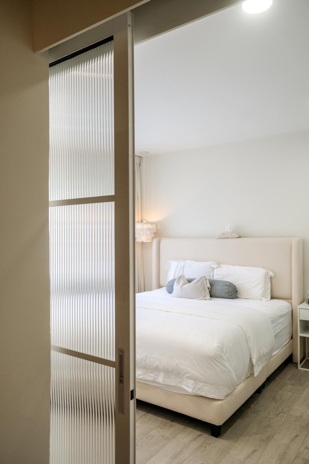 Minimalist Bedroom with Vinyl Flooring and Drop Ceiling