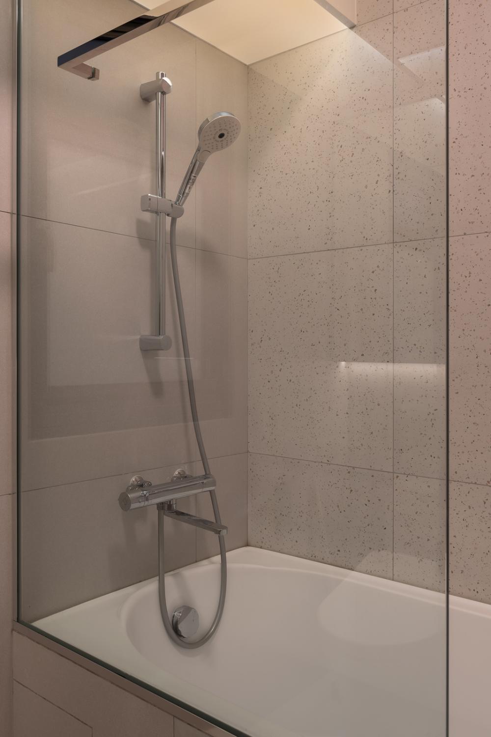 Scandinavian Bathroom with Homogeneous Tiles and Bathtub