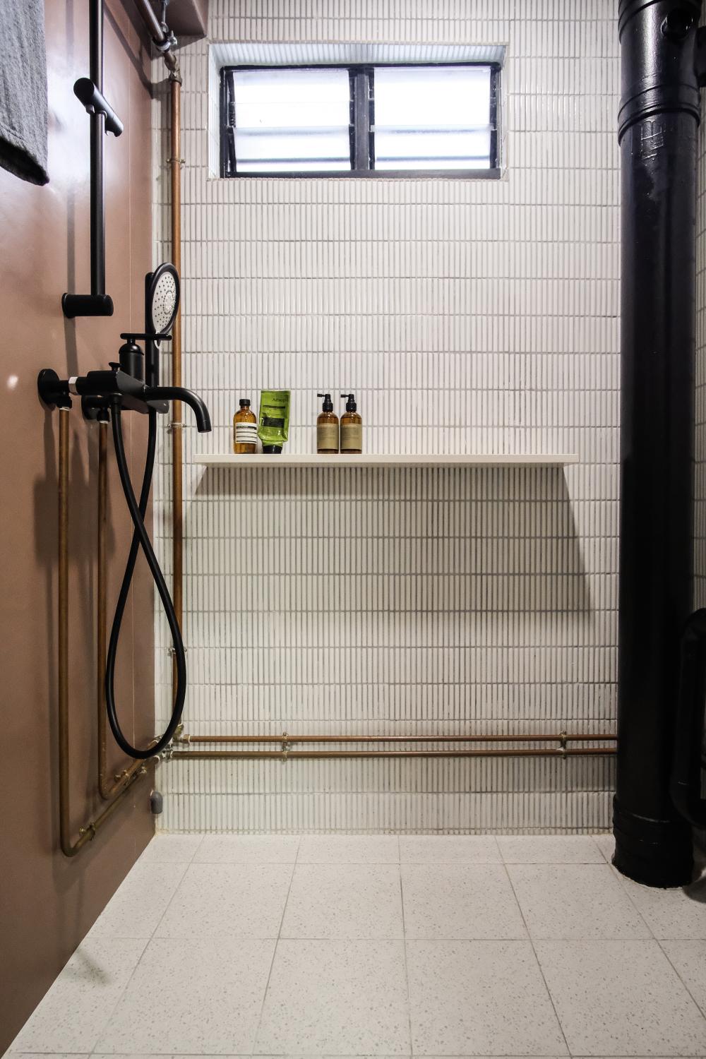 Transitional Bathroom with Wall Shelves and Showers