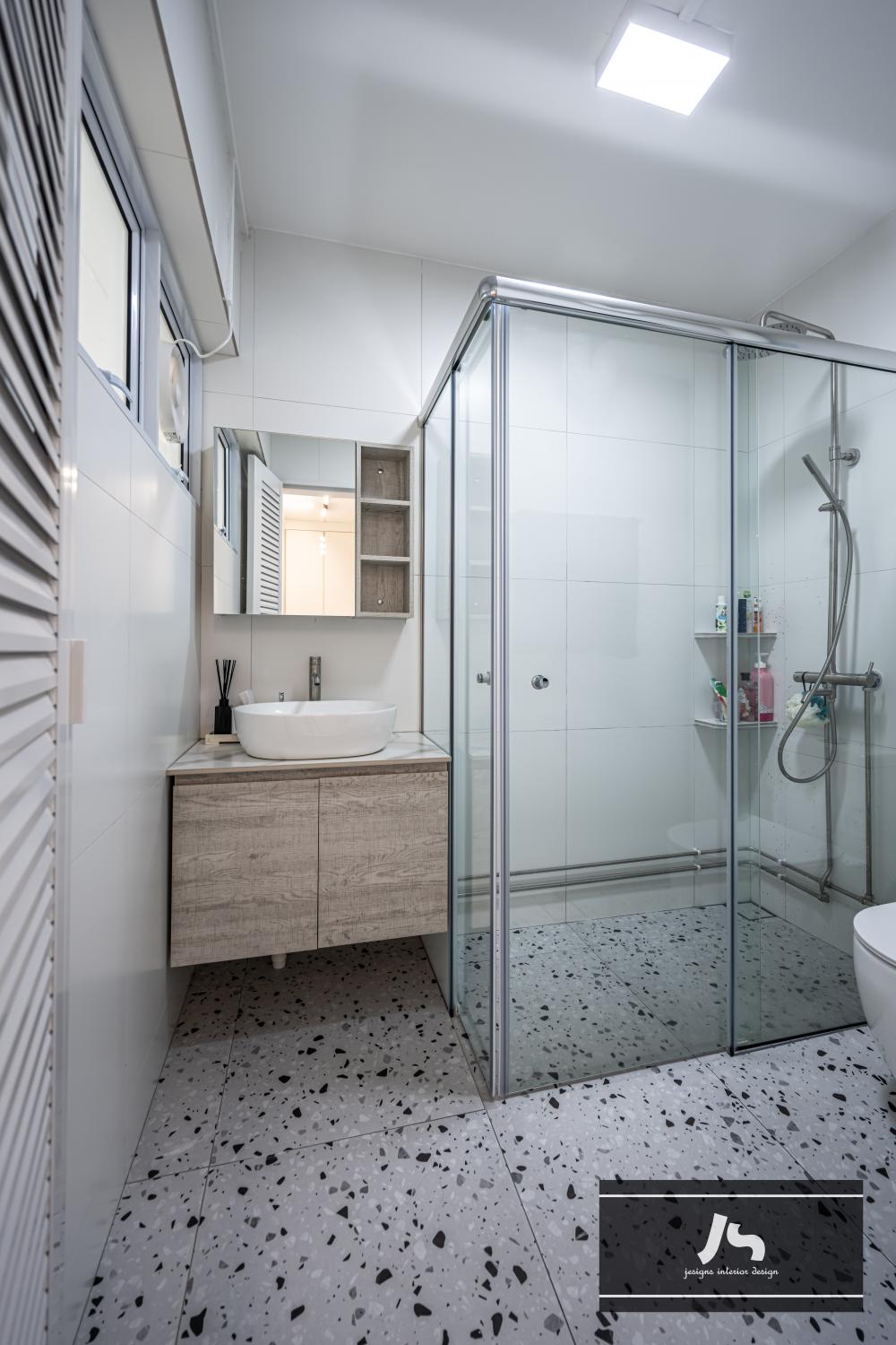 Minimalist Bathroom with Homogeneous Tiles and Rainshower
