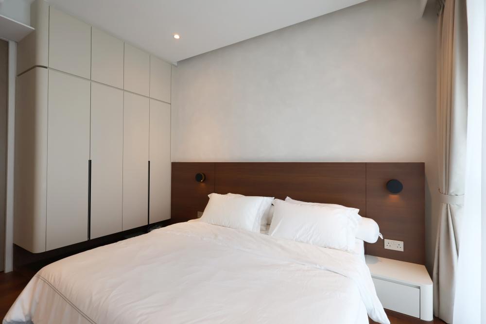 Minimalist Bedroom with Parquet Floor and Ceiling Light