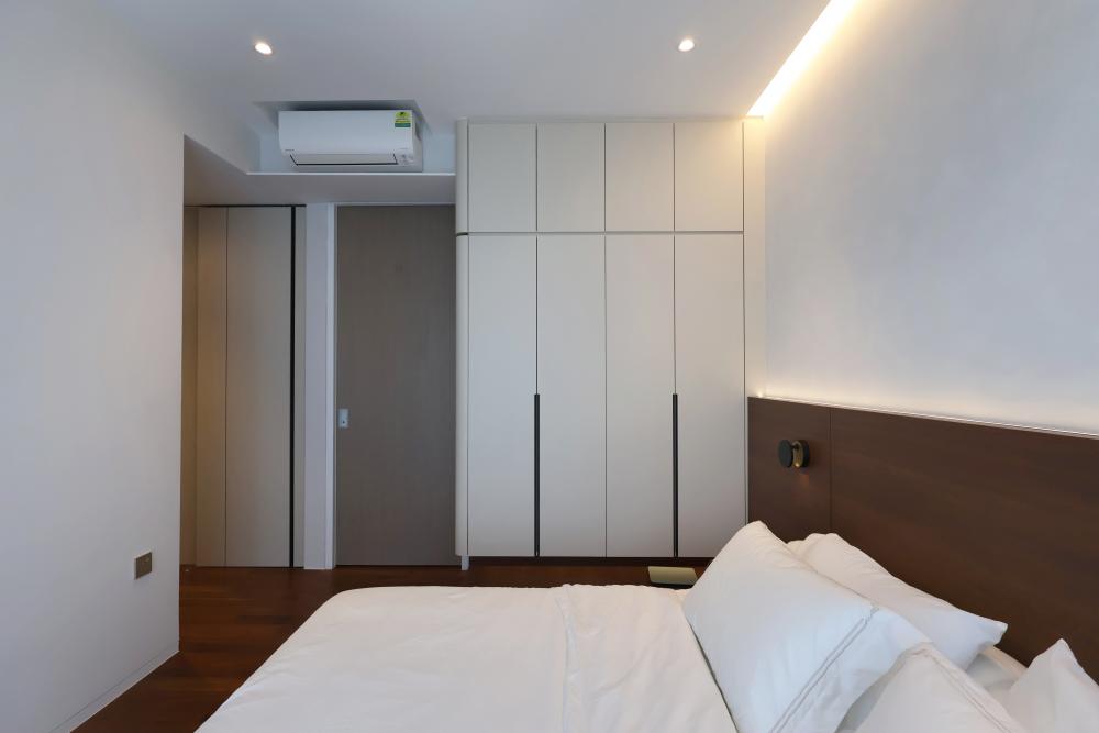 Minimalist Bedroom with Parquet Floor and Ceiling Light