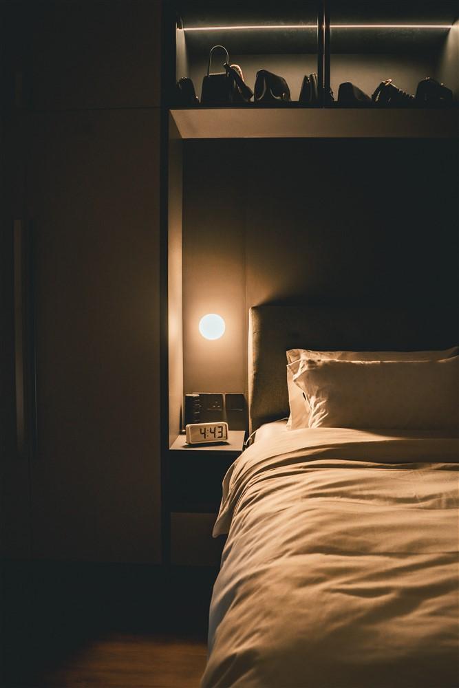 Contemporary Bedroom with Cove Lighting and Bedside Table