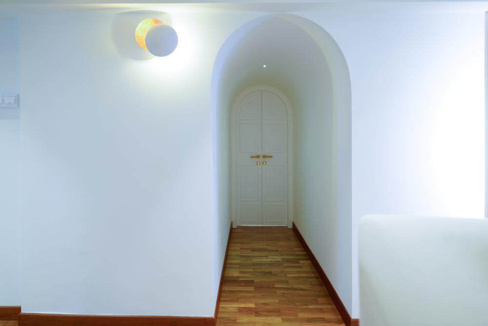 Scandinavian Hallway with Paintings and Lighting