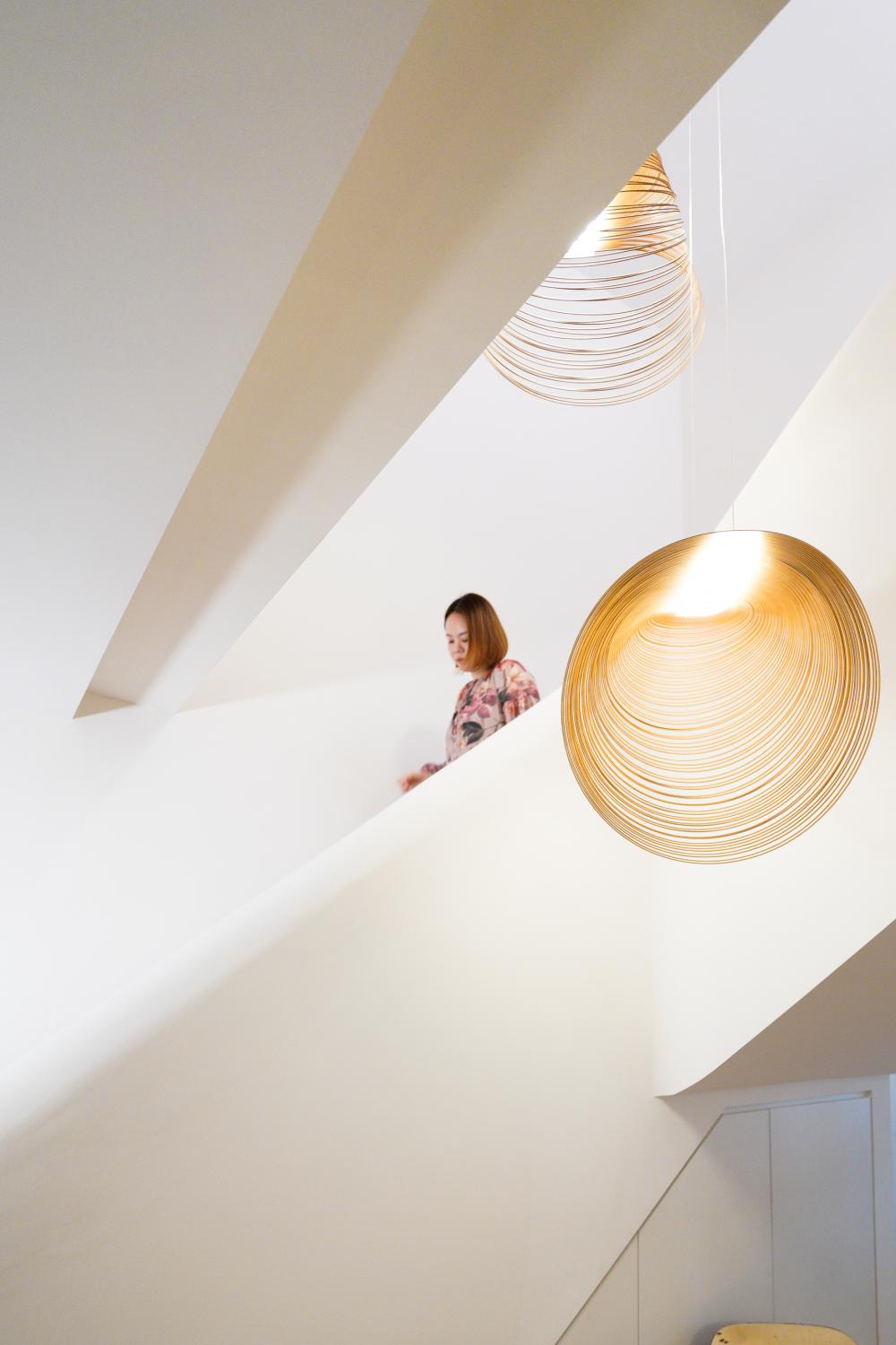 Scandinavian Entryway with Staircase and Lighting