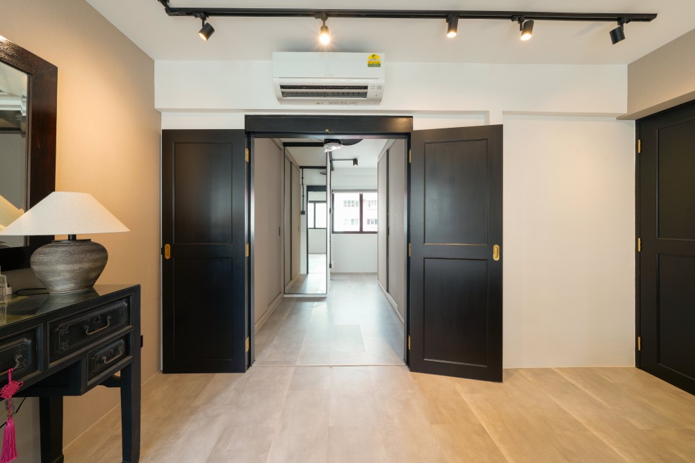 Industrial Hallway with Bookshelf and Artwork