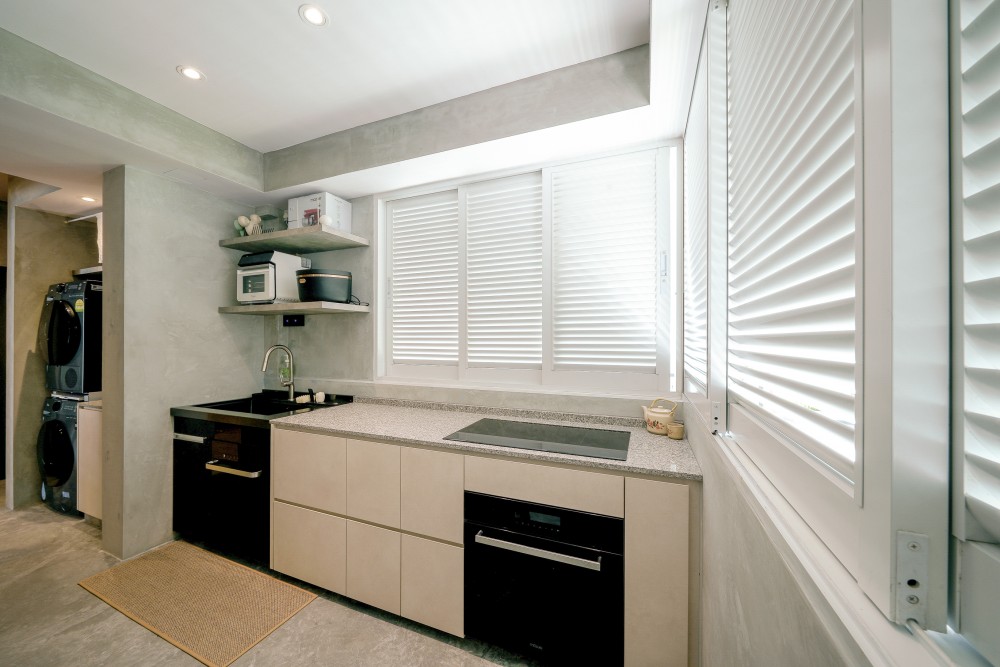 Scandinavian Kitchen with Cement Floor and Cupboard