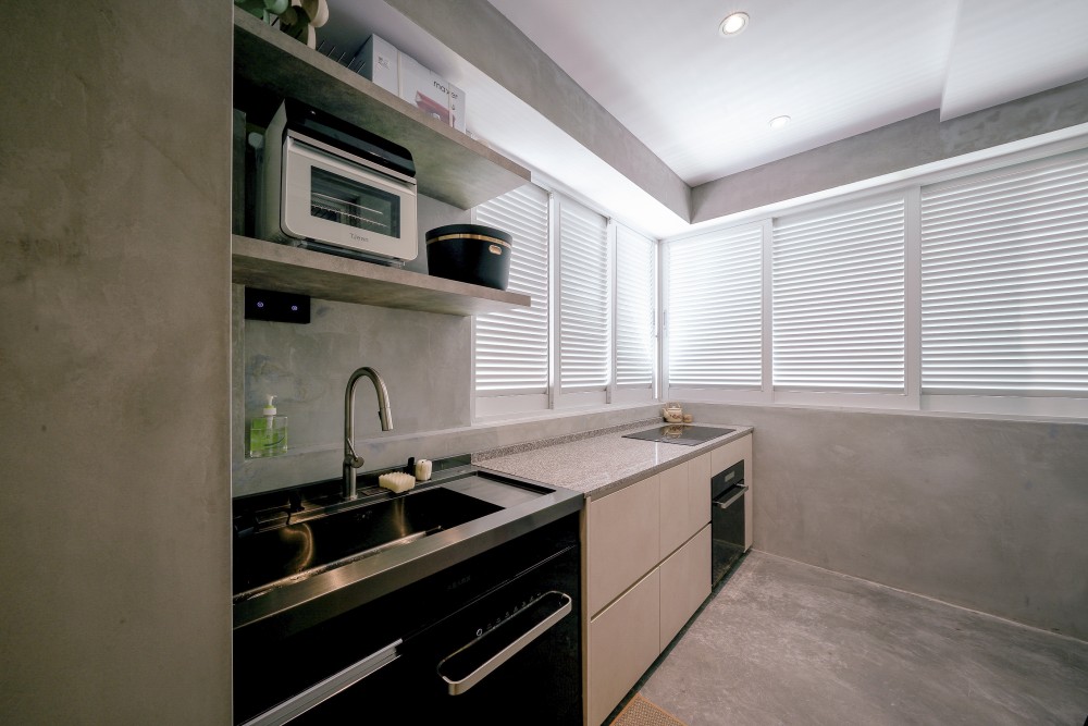 Scandinavian Kitchen with Cement Floor and Window Shutters
