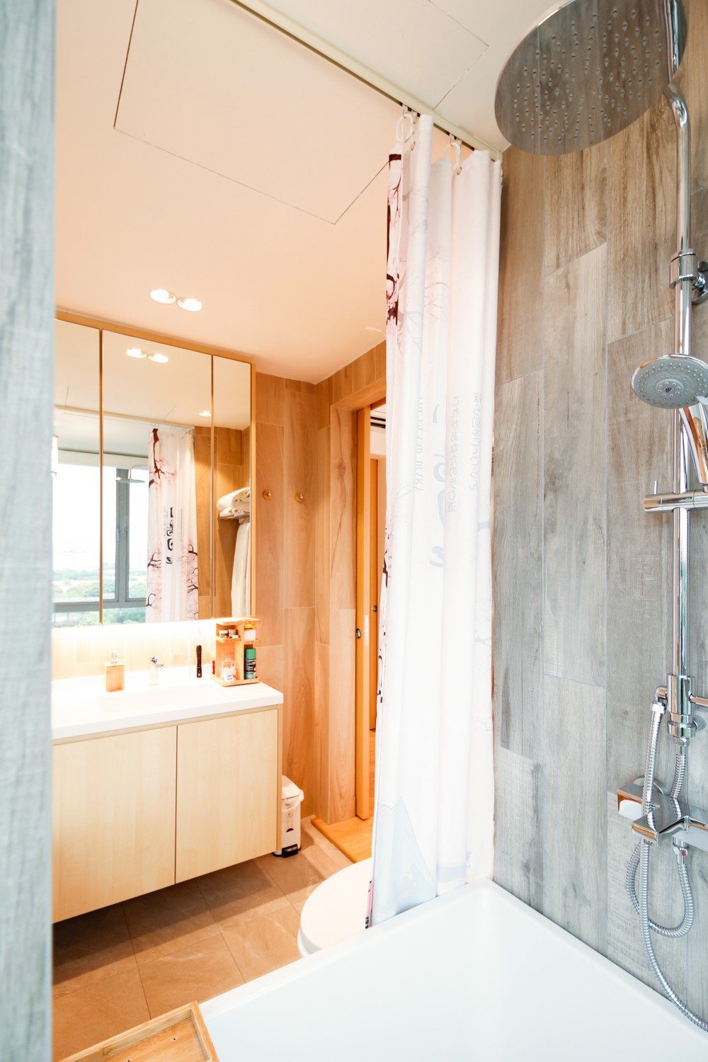 Asian Bathroom with Mirror and Bathtub