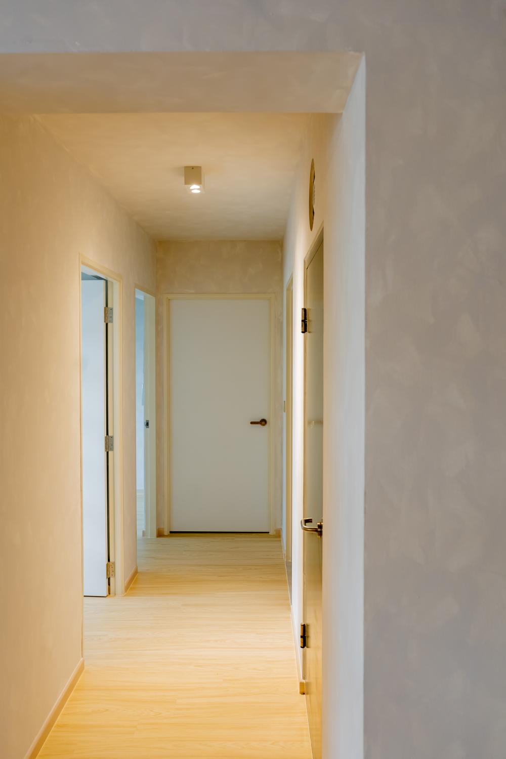 Scandinavian Hallway with Vinyl Flooring and Paintings