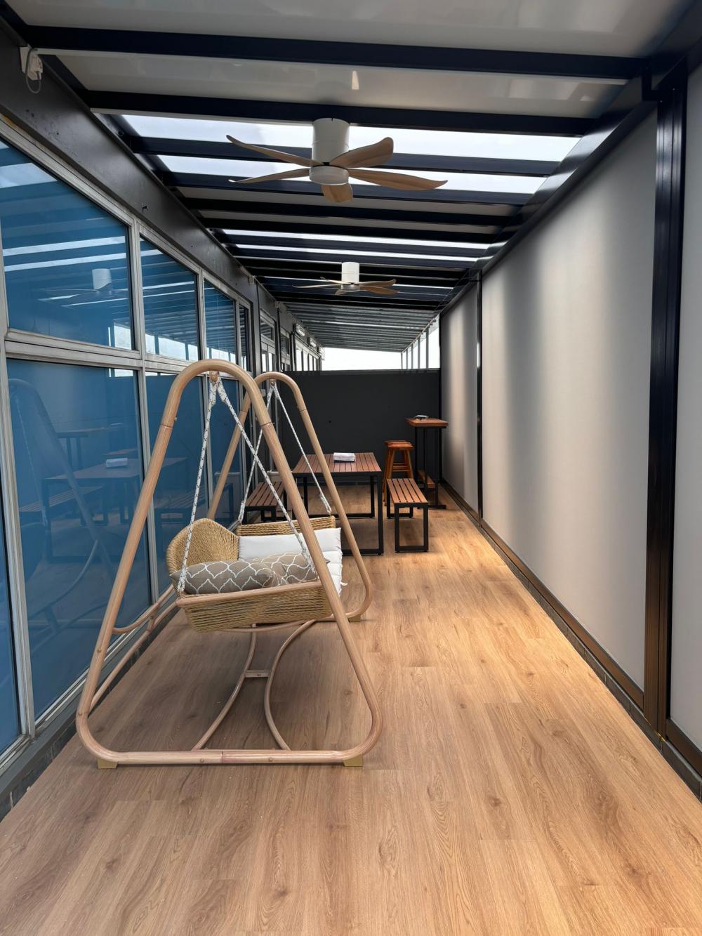 Minimalist Balcony with Vinyl Flooring and Glass Door