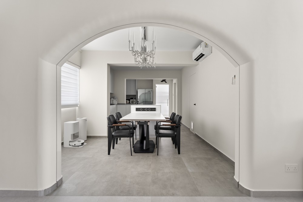 Minimalist Dining Room with Chandelier and Dining Table