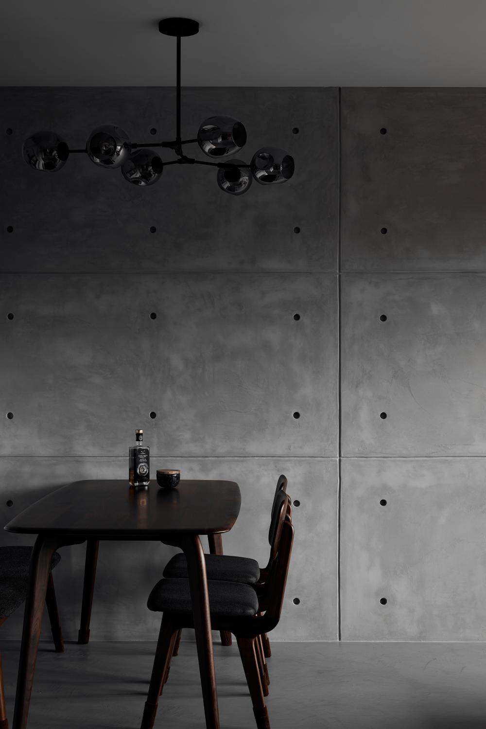 Industrial Dining Room with Drop Light and Dining Table