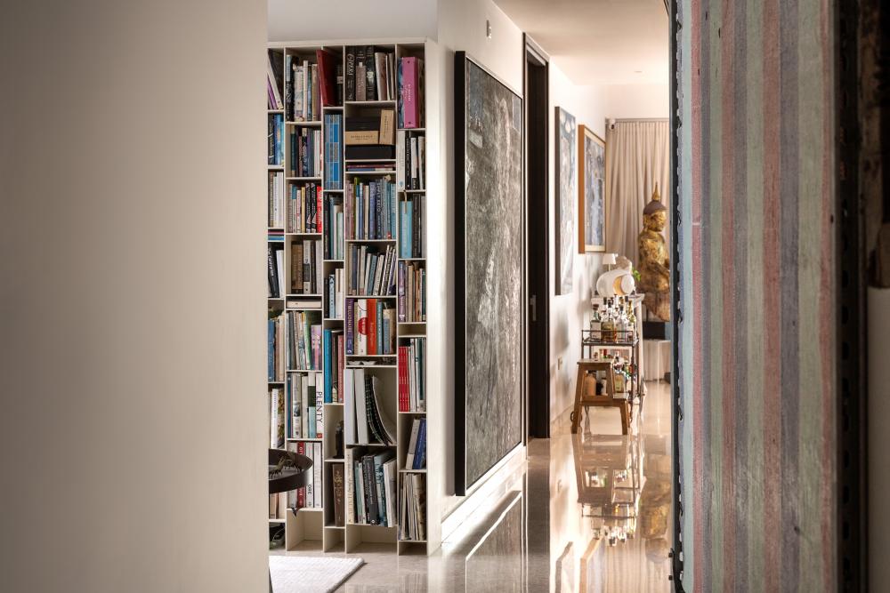 Contemporary Hallway with Bookshelf and Artwork