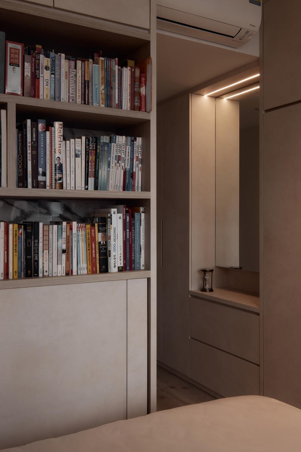 Modern Bedroom with Bookshelf and Wood Flooring