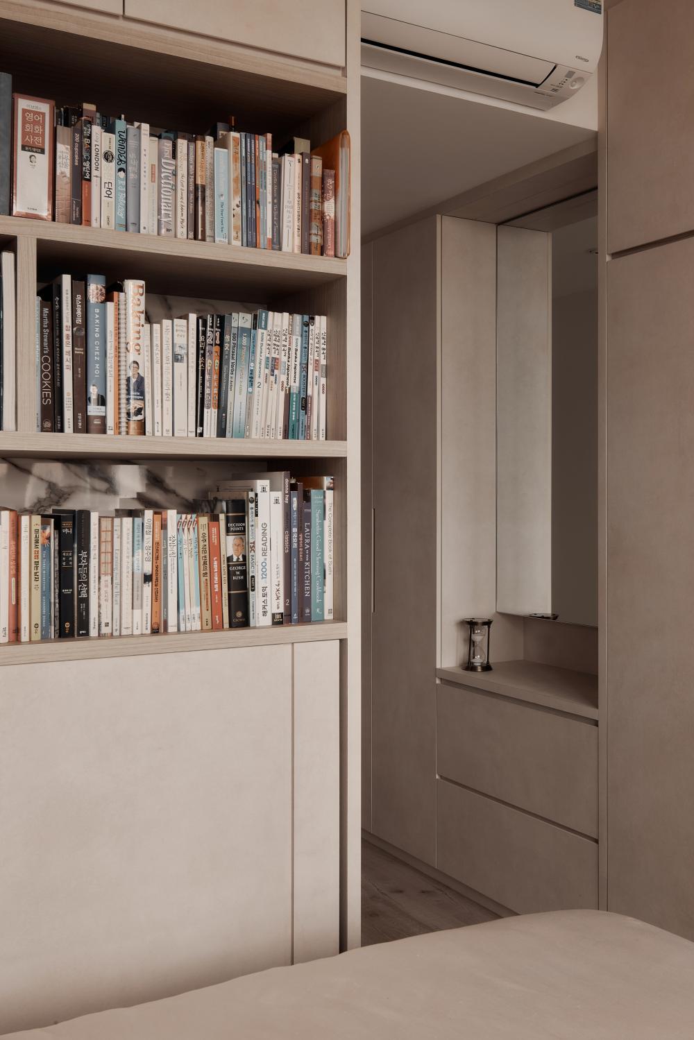 Modern Bedroom with Bookshelf and Wood Flooring