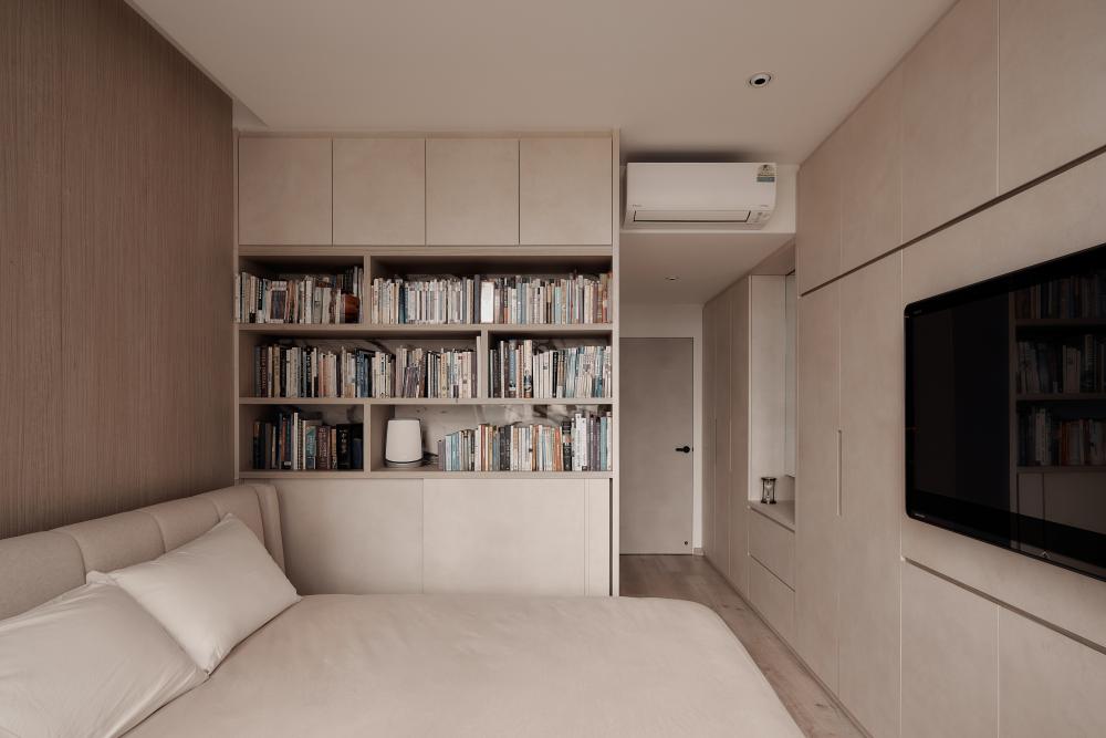 Modern Bedroom with Bookshelf and Wood Flooring