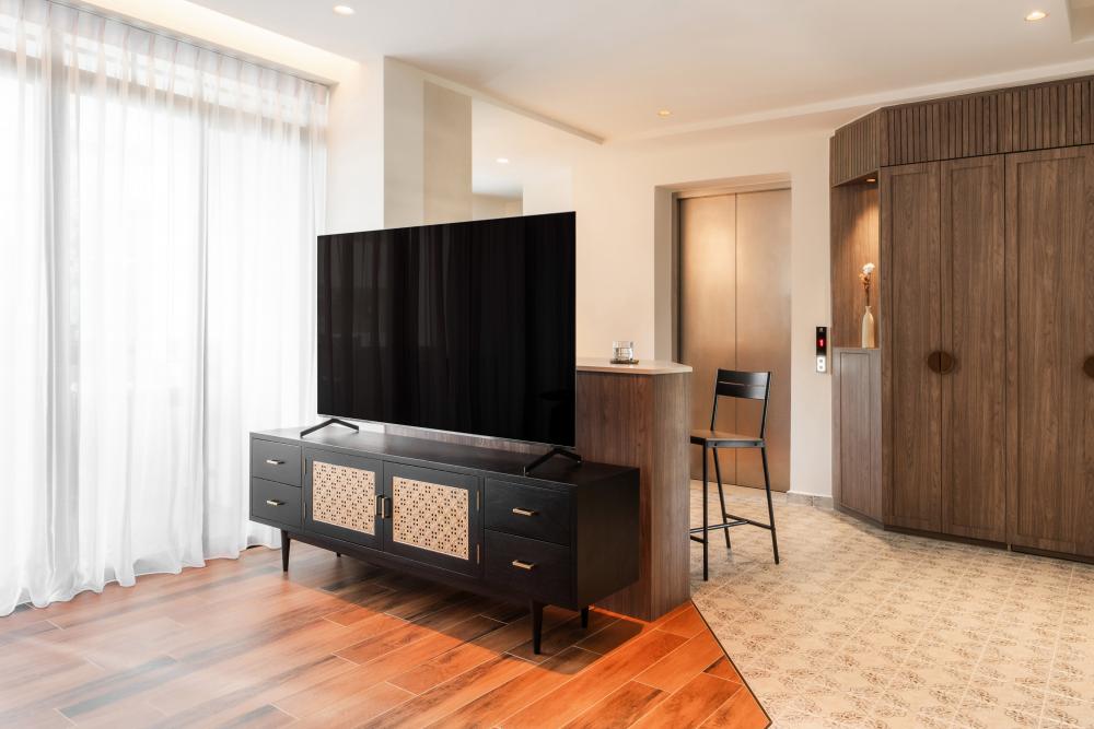 Asian Living Room with Wood Flooring and TV Console