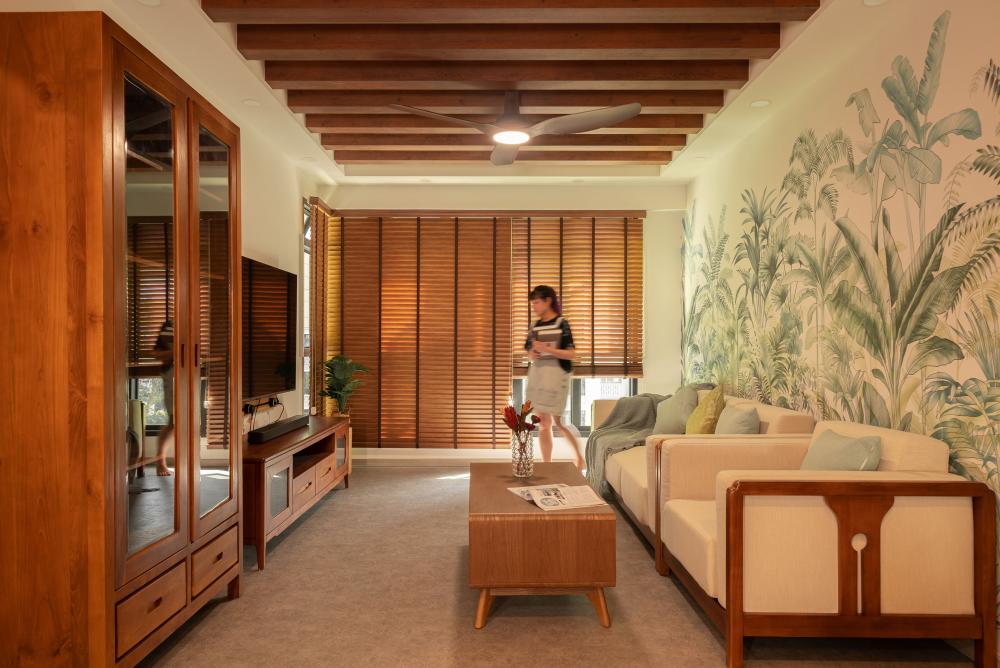 Asian Living Room with Cement Floor and Drop Ceiling