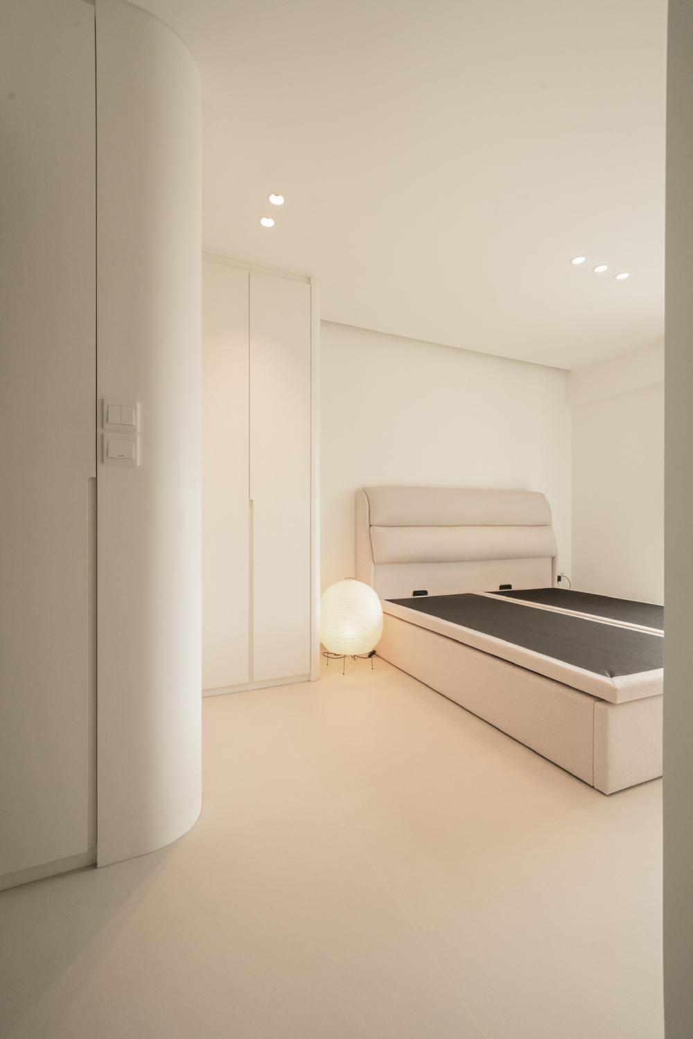Minimalist Bedroom with Bookshelf and Wardrobe