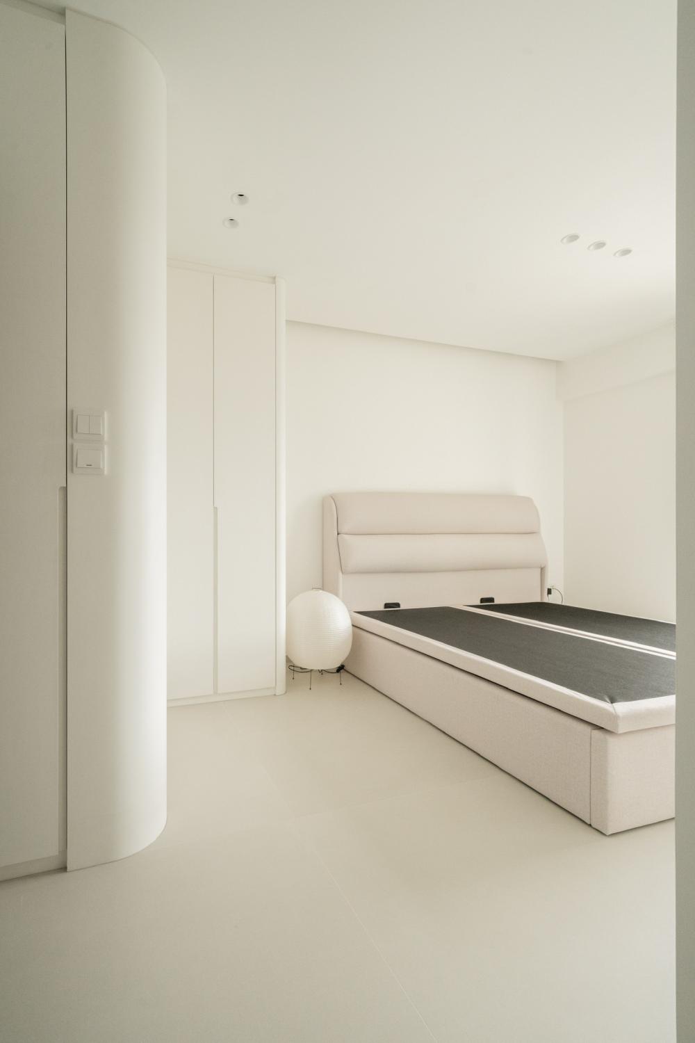 Minimalist Bedroom with Bookshelf and Wardrobe