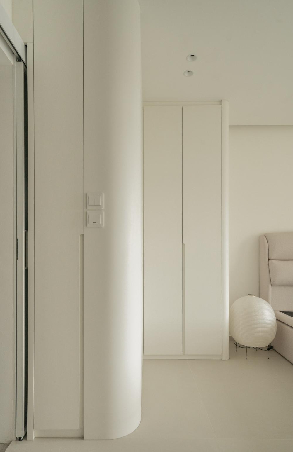 Minimalist Bedroom with Bookshelf and Wardrobe