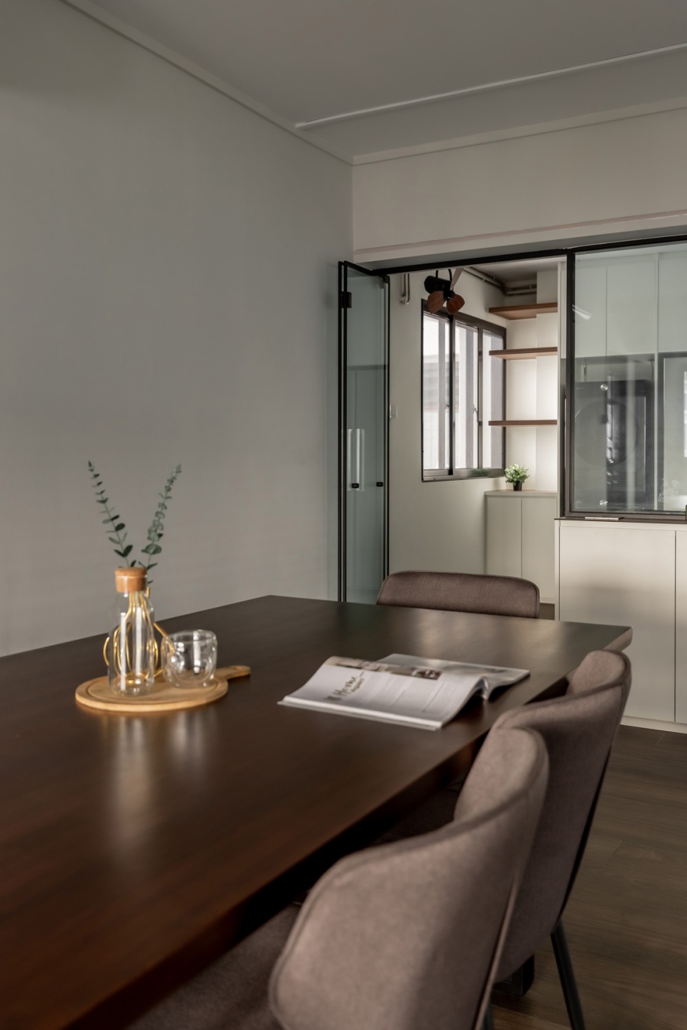 Modern Dining Room with Glass Door and Ceiling Light