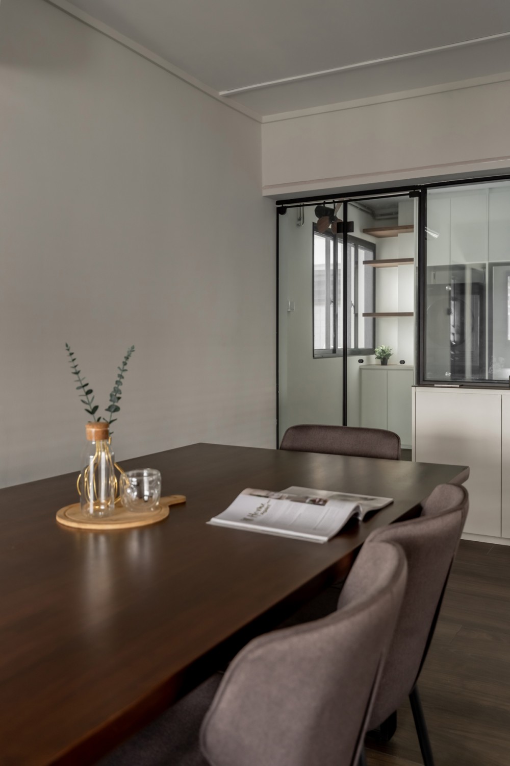 Modern Dining Room with Glass Door and Ceiling Light