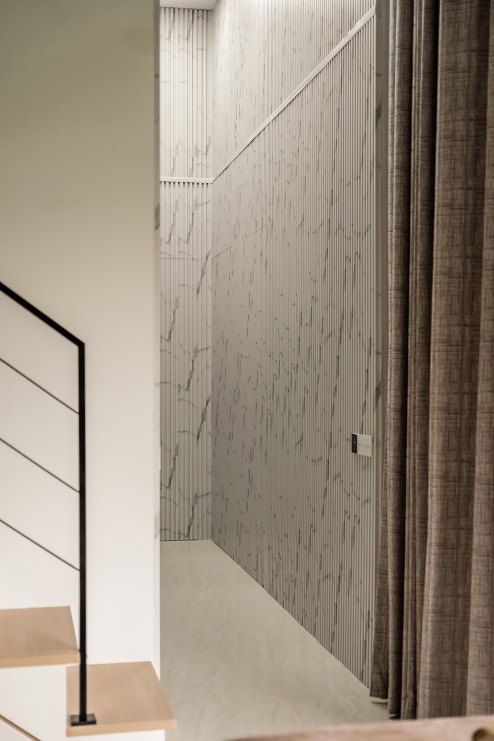Contemporary Entryway with Feature Wall and Staircase