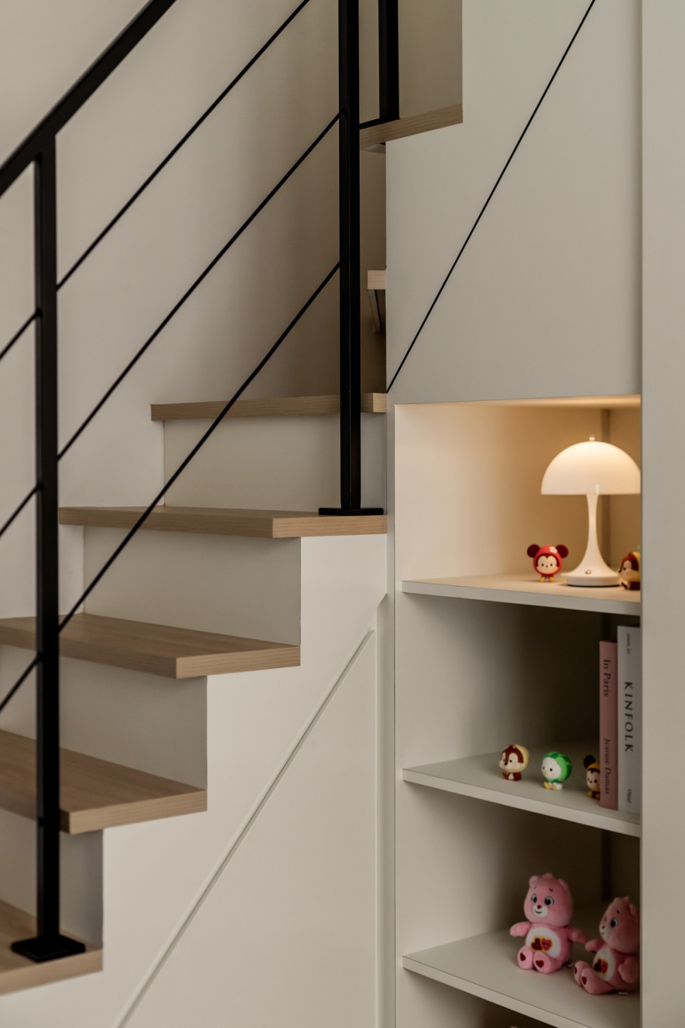 Contemporary Bedroom with Bookshelf and Staircase